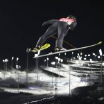
              Katharina Althaus, of Germany, soars through the air during the women's normal hill individual ski jumping trial round at the 2022 Winter Olympics, Saturday, Feb. 5, 2022, in Zhangjiakou, China. (AP Photo/Matthias Schrader)
            