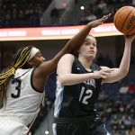 
              Villanova's Lior Garzon (12) shoots as Connecticut's Aaliyah Edwards (3) defends in the second half of an NCAA college basketball game, Wednesday, Feb. 9, 2022, in Hartford, Conn. (AP Photo/Jessica Hill)
            