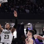 
              Purdue guard Jaden Ivey, left, drives to the basket against Northwestern during the first half of an NCAA college basketball game in Evanston, Ill., Wednesday, Feb. 16, 2022. (AP Photo/Nam Y. Huh)
            