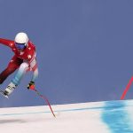 
              Corinne Suter, of Switzerland makes a jump during the women's downhill at the 2022 Winter Olympics, Tuesday, Feb. 15, 2022, in the Yanqing district of Beijing. (AP Photo/Robert F. Bukaty)
            
