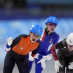 
              Irene Schouten of the Netherlands reacts after winning the gold medal ahead of silver medalist Ivanie Blondin of Canada, right, and bronze medalist Francesca Lollobrigida of Italy, behind, in the women's speedskating mass start finals at the 2022 Winter Olympics, Saturday, Feb. 19, 2022, in Beijing. (AP Photo/Sue Ogrocki)
            