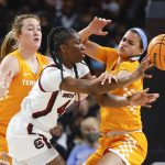 
              South Carolina's Saniya Rivers, center, passes the ball as Tennessee's Tess Darby, left, and Rae Burrell, right apply pressure during the first half of an NCAA college basketball game Sunday, Feb, 20, 2022, in Columbia, S.C. (Tracy Glantz/The State via AP)
            