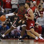 
              Ohio State's E.J. Liddell, left, posts up against Indiana's Race Thompson during the first half of an NCAA college basketball game Monday, Feb. 21, 2022, in Columbus, Ohio. (AP Photo/Jay LaPrete)
            