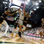 
              Colorado State's James Moors (10) grabs a rebound away from Wyoming's Hunter Maldonado (24) during the first half of an NCAA college basketball game Wednesday, Feb. 23, 2022, in Fort Collins, Colo. (AAron Ontiveroz/The Denver Post via AP)
            