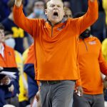 
              Illinois head coach Brad Underwood shouts to his team during the second half of an NCAA college basketball game against Michigan Sunday, Feb. 27, 2022, in Ann Arbor, Mich. Illinois defeated Michigan 93-85. (AP Photo/Duane Burleson)
            