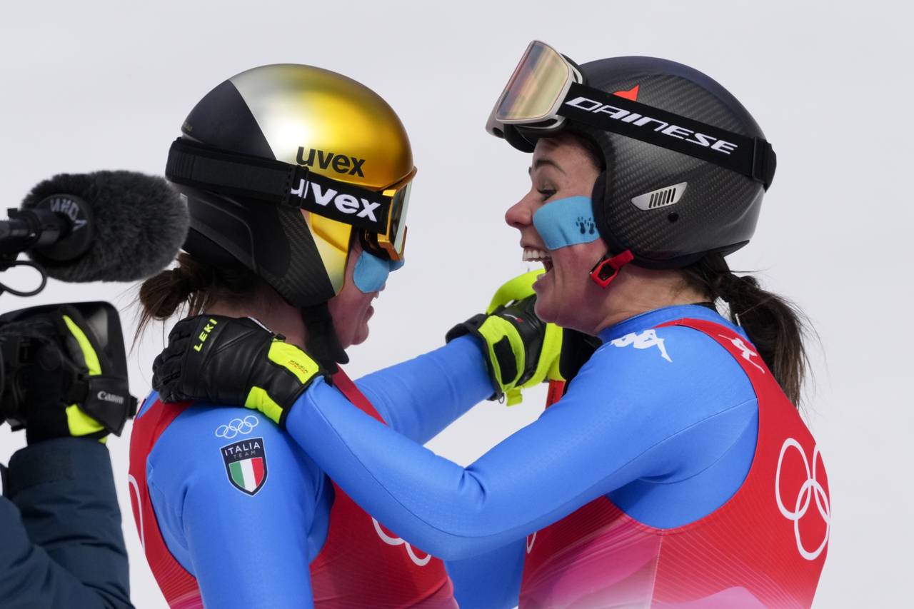 Nadia Delago, left, and Nicol Delago, of Italy, embrace after finishing the women's downhill at the...