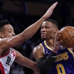
              Los Angeles Lakers guard Russell Westbrook, right, goes up for a shot as Portland Trail Blazers guard CJ McCollum defends during the first half of an NBA basketball game Wednesday, Feb. 2, 2022, in Los Angeles. (AP Photo/Mark J. Terrill)
            