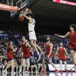 
              Gonzaga center Chet Holmgren (34) dunks during the second half of the team's NCAA college basketball game against Saint Mary's, Saturday, Feb. 12, 2022, in Spokane, Wash. Gonzaga won 74-58. (AP Photo/Young Kwak)
            