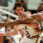 
              FILE - Utah Jazz guard John Stockton (12) drives against San Antonio Spurs center David Robinson in the second period Sunday, May 12, 1996, in Salt Lake City. (AP Photo/Douglas C. Pizac, File)
            