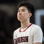 
              Davidson guard Hyunjung Lee looks on during the second half of an NCAA college basketball game against Virginia Commonwealth in Davidson, N.C., Wednesday, Jan. 26, 2022. (AP Photo/Jacob Kupferman)
            