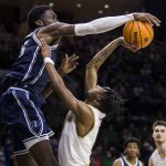 
              Duke's Mark Williams, left, blocks a shot by Notre Dame's Blake Wesley during the second half of an NCAA college basketball game Monday, Jan. 31, 2022, in South Bend, Ind. (AP Photo/Robert Franklin)
            