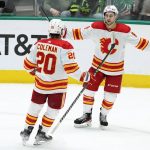 
              Calgary Flames' Blake Coleman (20) and Andrew Mangiapane (88) celebrate a goal scored by Mangiapane in the third period of an NHL hockey game against the Dallas Stars in Dallas, Tuesday, Feb. 1, 2022. Coleman had the assist on the goal. (AP Photo/Tony Gutierrez)
            
