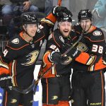 
              Anaheim Ducks' Cam Fowler (4) and Nicolas Deslauriers (20) celebrate a goal by Derek Grant (38) against the San Jose Sharks during the first period in an NHL hockey game Tuesday, Feb. 22, 2022, in Anaheim, Calif. (AP Photo/John McCoy)
            