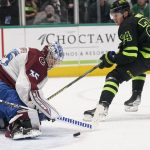 
              Colorado Avalanche goaltender Darcy Kuemper (35) blocks a shot by Dallas Stars center Roope Hintz (24) during the first period of an NHL hockey game in Dallas, Sunday, Feb. 13, 2022. (AP Photo/LM Otero)
            