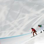 
              Canada's Meryeta O'Dine, left, and France's Julia Pereira de Sousa Mabileau run the course during the women's snowboard cross finals at the 2022 Winter Olympics, Wednesday, Feb. 9, 2022, in Zhangjiakou, China. (AP Photo/Francisco Seco)
            