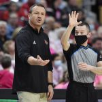 
              Louisville head coach Jeff Walz argues with a game official during the first half of an NCAA college basketball game against Virginia Tech in Louisville, Ky., Sunday, Feb. 20, 2022. (AP Photo/Timothy D. Easley)
            