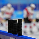 
              Pucks are stacked on the boards for Russian Olympic Committee players to use when they warm up for a preliminary round women's hockey game against Switzerland at the 2022 Winter Olympics, Friday, Feb. 4, 2022, in Beijing. (AP Photo/Matt Slocum)
            