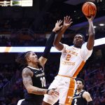 
              Tennessee forward Brandon Huntley-Hatfield (2) shoots as he is defended by Vanderbilt forward Myles Stute (10) during the first half of an NCAA college basketball game Saturday, Feb. 12, 2022, in Knoxville, Tenn. (AP Photo/Wade Payne)
            