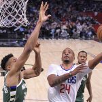 
              Los Angeles Clippers forward Norman Powell, right, shoots as Milwaukee Bucks forward Giannis Antetokounmpo defends during the second half of an NBA basketball game Sunday, Feb. 6, 2022, in Los Angeles. (AP Photo/Mark J. Terrill)
            