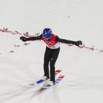 
              Ryoyu Kobayashi, of Japan, lands during the men's normal hill individual ski jumping final at the 2022 Winter Olympics, Sunday, Feb. 6, 2022, in Zhangjiakou, China. (AP Photo/Matthias Schrader)
            