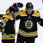 
              Boston Bruins left wing Taylor Hall (71) is congratulated by David Pastrnak, right, after his goal during the second period of an NHL hockey game against the Seattle Kraken, Tuesday, Feb. 1, 2022, in Boston. (AP Photo/Charles Krupa)
            