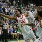 
              Houston center Josh Carlton (25) reaches for a rebound next to Tulane forward Kevin Cross (24), as Houston guard Kyler Edwards (11) watches during the first half of an NCAA college basketball game in New Orleans, Wednesday, Feb. 23, 2022. (AP Photo/Matthew Hinton)
            