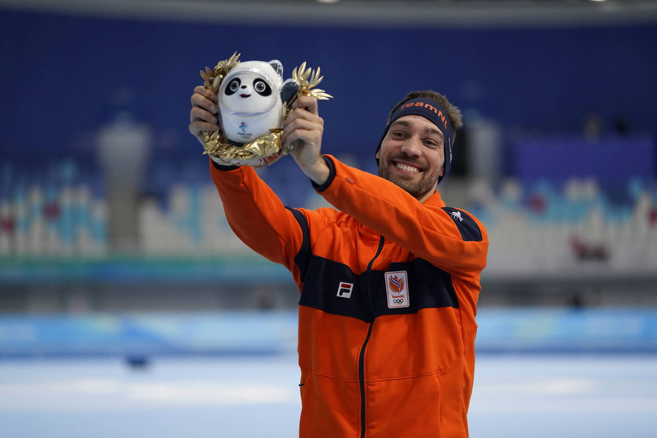 Kjeld Nuis of the Netherlands celebrates his gold medal and Olympic record during a venue ceremony ...