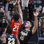 
              Purdue center Zach Edey (15) attempts to block a shot by Illinois center Kofi Cockburn (21) during the second half of an NCAA college basketball game, Tuesday, Feb. 8, 2022, in West Lafayette, Ind. (AP Photo/Doug McSchooler)
            