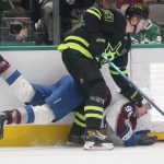 
              Colorado Avalanche right wing Mikko Rantanen (96) is knocked to the ice by Dallas Stars defenseman Esa Lindell (23) during the second period of an NHL hockey game in Dallas, Sunday, Feb. 13, 2022. (AP Photo/LM Otero)
            