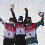 
              From left, silver medalist United States's Julia Marino, gold medalist New Zealand's Zoi Sadowski Synnott and bronze medalist Australia's Tess Coady celebrate after the women's slopestyle finals at the 2022 Winter Olympics, Sunday, Feb. 6, 2022, in Zhangjiakou, China. (AP Photo/Gregory Bull)
            