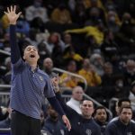 
              Marquette coach Shaka Smart gestures as he yells from the sideline during the first half of the team's NCAA college basketball game against Villanova on Wednesday, Feb. 2, 2022, in Milwaukee. (AP Photo/Aaron Gash)
            