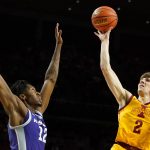 
              Iowa State guard Caleb Grill (2) shoots over Kansas State forward Carlton Linguard Jr. (12) during the first half of an NCAA college basketball game, Saturday, Feb. 12, 2022, in Ames, Iowa. (AP Photo/Charlie Neibergall)
            