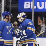 
              St. Louis Blues right wing Vladimir Tarasenko (91) and goaltender Ville Husso (35) celebrate the team's victory over the Chicago Blackhawks in an NHL hockey game Saturday, Feb. 12, 2022, in St. Louis. (AP Photo/Joe Puetz)
            