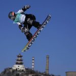 
              Hailey Langland of the United States competes during the women's snowboard big air qualifications of the 2022 Winter Olympics, Monday, Feb. 14, 2022, in Beijing. (AP Photo/Ashley Landis)
            