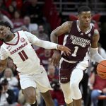 
              Mississippi State guard Iverson Molinar (1) tries to get past Arkansas guard Chris Lykes (11) during the second half of an NCAA college basketball game Saturday, Feb. 5, 2022, in Fayetteville, Ark. (AP Photo/Michael Woods)
            