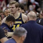 
              Wisconsin head coach Greg Gard, right, is involved in a scuffle with Michigan head coach Juwan Howard during the waning moments of an NCAA college basketball game Sunday, Feb. 20, 2022, in Madison, Wis. (Mark Hoffman/Milwaukee Journal-Sentinel via AP)
            