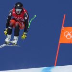 
              Broderick Thompson of Canada makes a jump during men's downhill training at the 2022 Winter Olympics, Friday, Feb. 4, 2022, in the Yanqing district of Beijing. (AP Photo/Robert F. Bukaty)
            