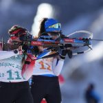 
              Lena Haecki of Switzerland, left, and Susan Kuelm of Estonia shoot during the women's 4x6-kilometer relay at the 2022 Winter Olympics, Wednesday, Feb. 16, 2022, in Zhangjiakou, China. (AP Photo/Frank Augstein)
            
