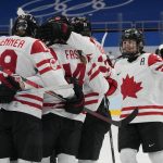 
              Team Canada players celebrate after a goal by Renata Fast (14) during a women's semifinal hockey game against Switzerland at the 2022 Winter Olympics, Monday, Feb. 14, 2022, in Beijing. (AP Photo/Petr David Josek)
            