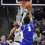 
              Connecticut's Isaiah Whaley blocks a shot by Xavier's Colby Jones (3) in the first half of an NCAA college basketball game, Saturday, Feb. 19, 2022, in Storrs, Conn. (AP Photo/Jessica Hill)
            