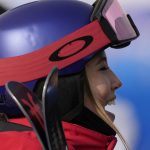 
              China's Eileen Gu talks to reporters after the women's halfpipe qualification at the 2022 Winter Olympics, Thursday, Feb. 17, 2022, in Zhangjiakou, China. (AP Photo/Francisco Seco)
            