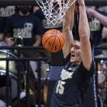 
              Purdue center Zach Edey (15) dunks during the first half of an NCAA college basketball game against Illinois, Tuesday, Feb. 8, 2022, in West Lafayette, Ind. (AP Photo/Doug McSchooler)
            
