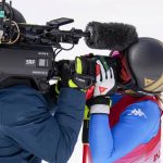
              Sofia Goggia, of Italy, kisses a camera after finishing the women's downhill at the 2022 Winter Olympics, Tuesday, Feb. 15, 2022, in the Yanqing district of Beijing. (AP Photo/Luca Bruno)
            