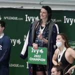 
              Pennsylvania's Lia Thomas, center, Yale's Iszak Henig, left, and Princeton's Nikki Venema stand on the podium following a medal ceremony after Thomas won the 100-yard freestyle, Henig finished second and Venema third at the Ivy League women's swimming and diving championships at Harvard, Saturday, Feb. 19, 2022, in Cambridge, Mass. Henig, who is transitioning to male but hasn't begun hormone treatments yet, is swimming for the Yale women's team and Thomas, who is transitioning to female, is swimming for the Penn women's team. (AP Photo/Mary Schwalm)
            