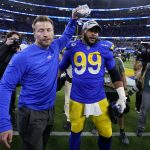 
              Los Angeles Rams head coach Sean McVay, left, and Aaron Donald celebrate after the NFC Championship NFL football game against the San Francisco 49ers Sunday, Jan. 30, 2022, in Inglewood, Calif. The Rams won 20-17 to advance to the Super Bowl. (AP Photo/Marcio Jose Sanchez)
            