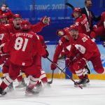 
              The Russian Olympic Committee celebrates the winning goal during a shootout by Arseni Gritsyuk (81) in a men's semifinal hockey game against Sweden at the 2022 Winter Olympics, Friday, Feb. 18, 2022, in Beijing. (AP Photo/Petr David Josek)
            