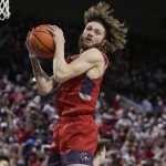 Saint Mary's guard Logan Johnson grabs a rebound during the first half of the team's NCAA college basketball game against Gonzaga, Saturday, Feb. 12, 2022, in Spokane, Wash. (AP Photo/Young Kwak)