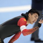 
              Gao Tingyu of China reacts after setting an Olympic record during the men's speedskating 500-meter race at the 2022 Winter Olympics, Saturday, Feb. 12, 2022, in Beijing. (AP Photo/Ashley Landis)
            