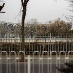 
              The National Stadium known as the Bird's Nest, seen fenced in from the bus, inside the bubble created for the 2022 Winter Olympics, Saturday, Feb. 12, 2022, in Beijing. (AP Photo/Nariman El-Mofty)
            