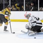 
              Vegas Golden Knights center Jonathan Marchessault (81) shoots against Los Angeles Kings goaltender Jonathan Quick during the second period of an NHL hockey game Friday, Feb. 18, 2022, in Las Vegas. (AP Photo/David Becker)
            